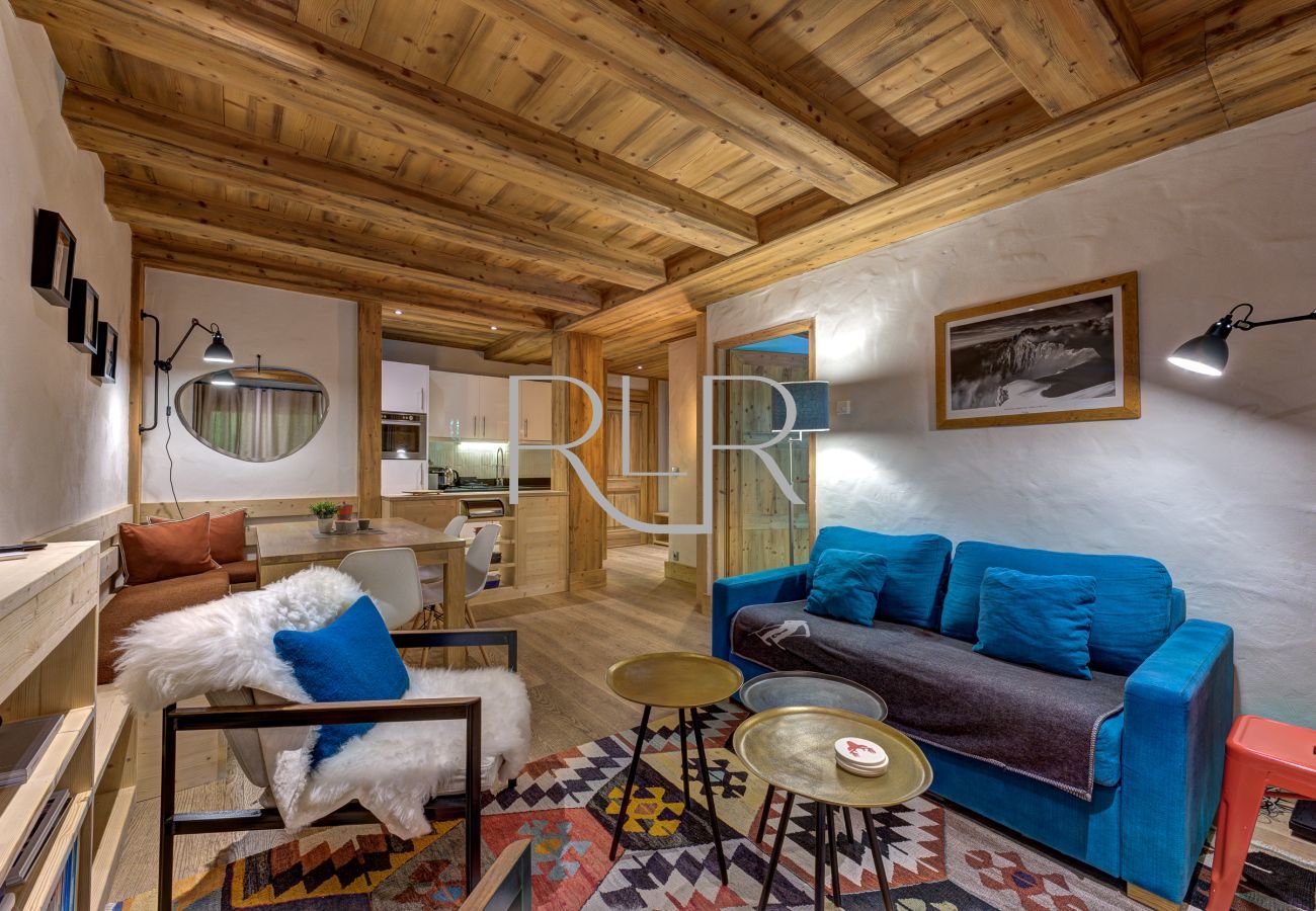 Le salon de l'appartement Blaitière 2 dispose d'une porte donnant sur la chambre 2.