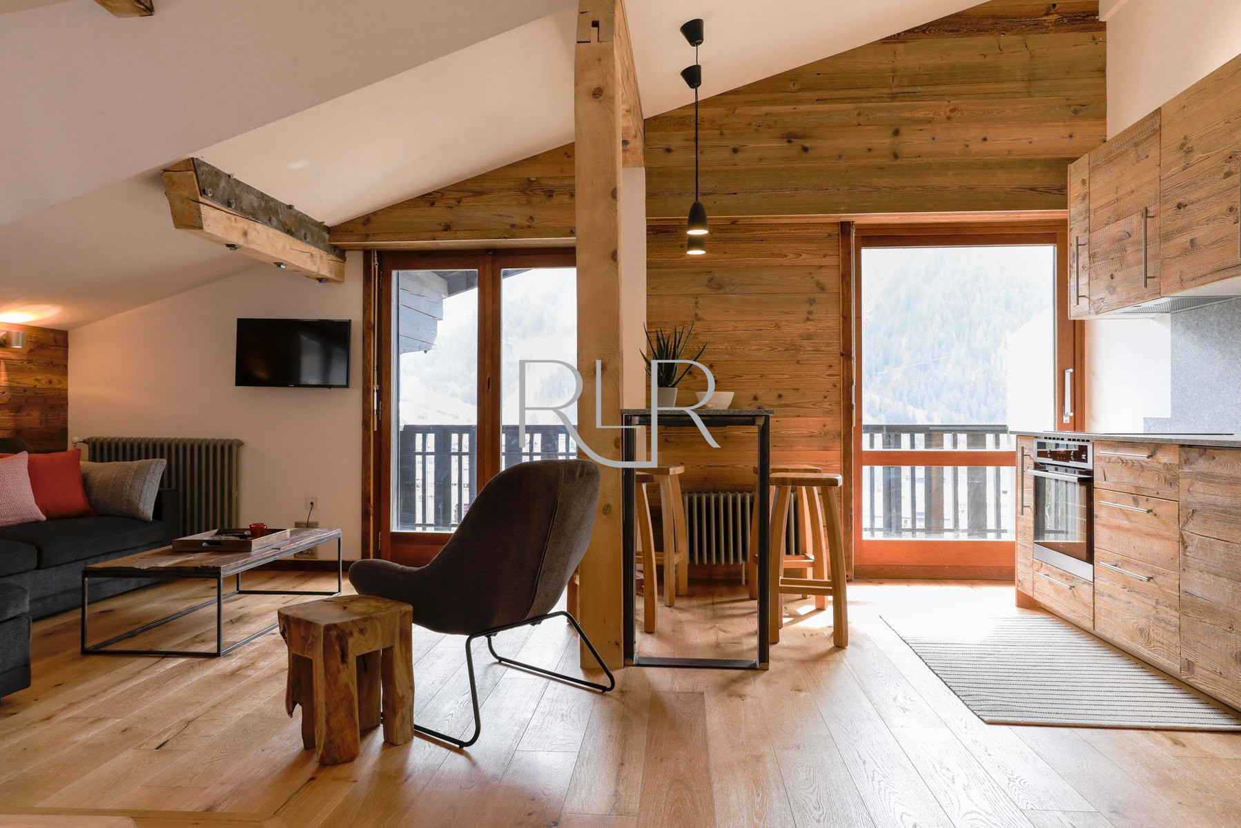 Brevent 1 has an open plan living area with 2 sets of glass doors onto the balcony  