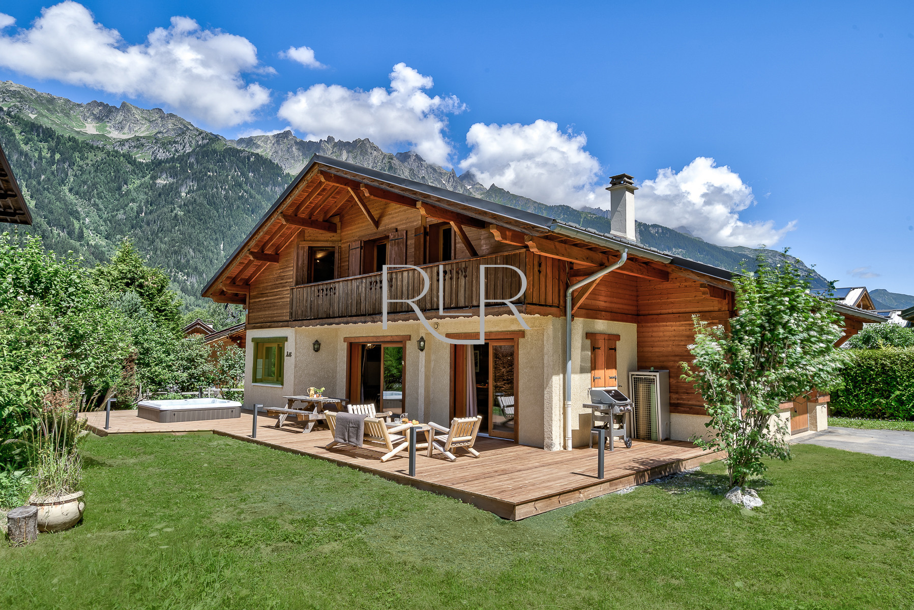 Chalet Sanaz has a large deck with outdoor furniture and BBQ