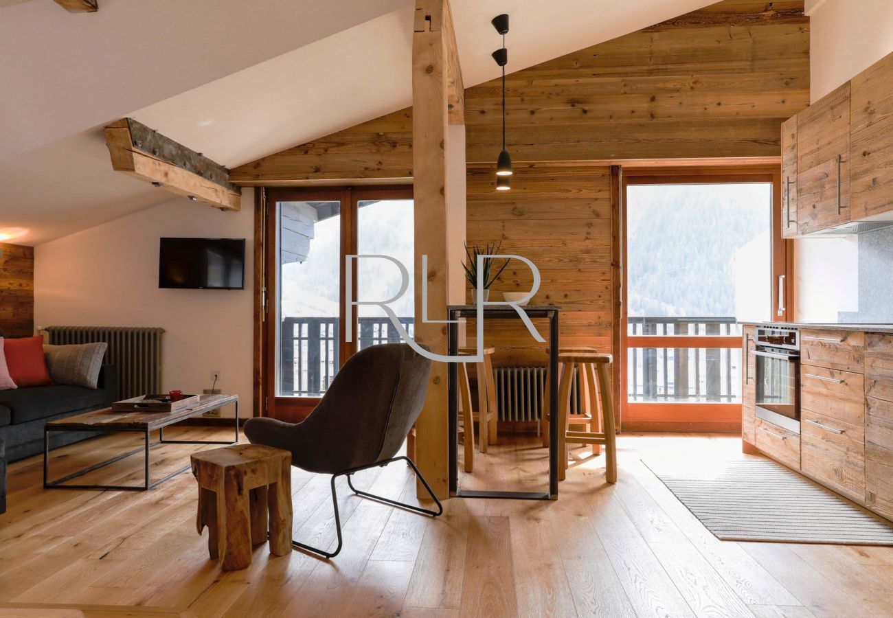 Brevent 1 has an open plan living area with 2 sets of glass doors onto the balcony  
