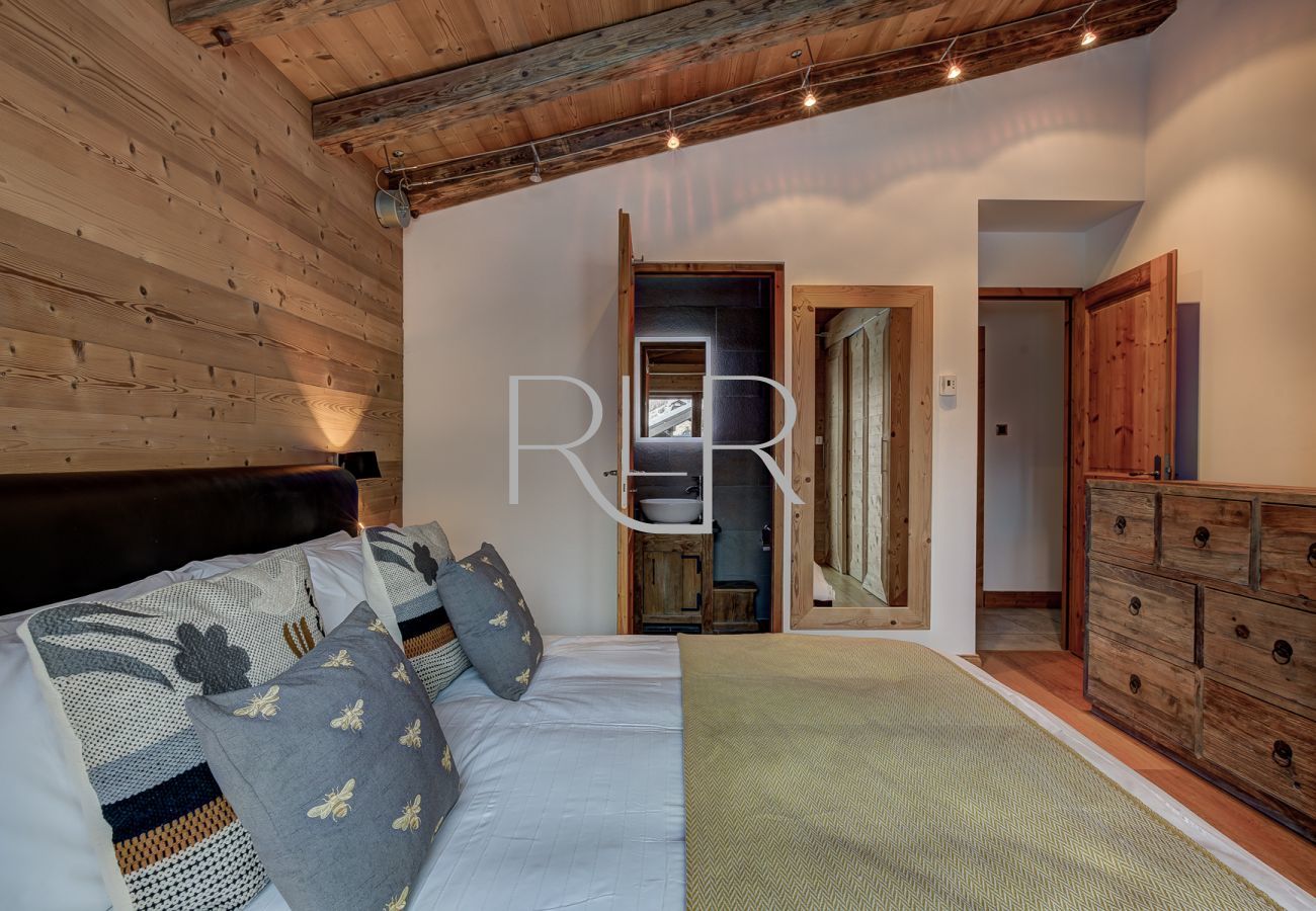Bedroom 1 of Chalet Capricorne is  double room with ensuite and balcony