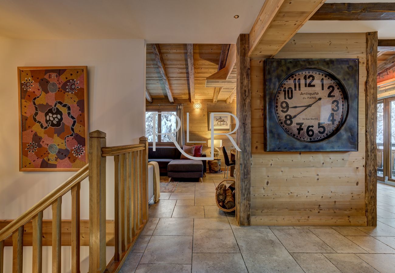 In Chalet Capricorne  stairs lead to the 1st floor, open-plan living area