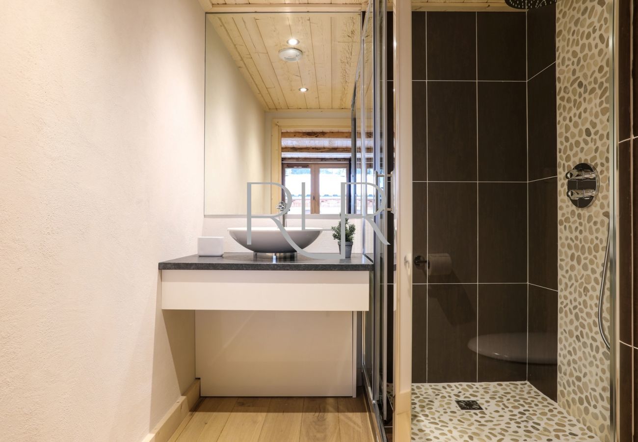 Blaitiere 6's Bedroom 1 has an ensuite with shower and basin   