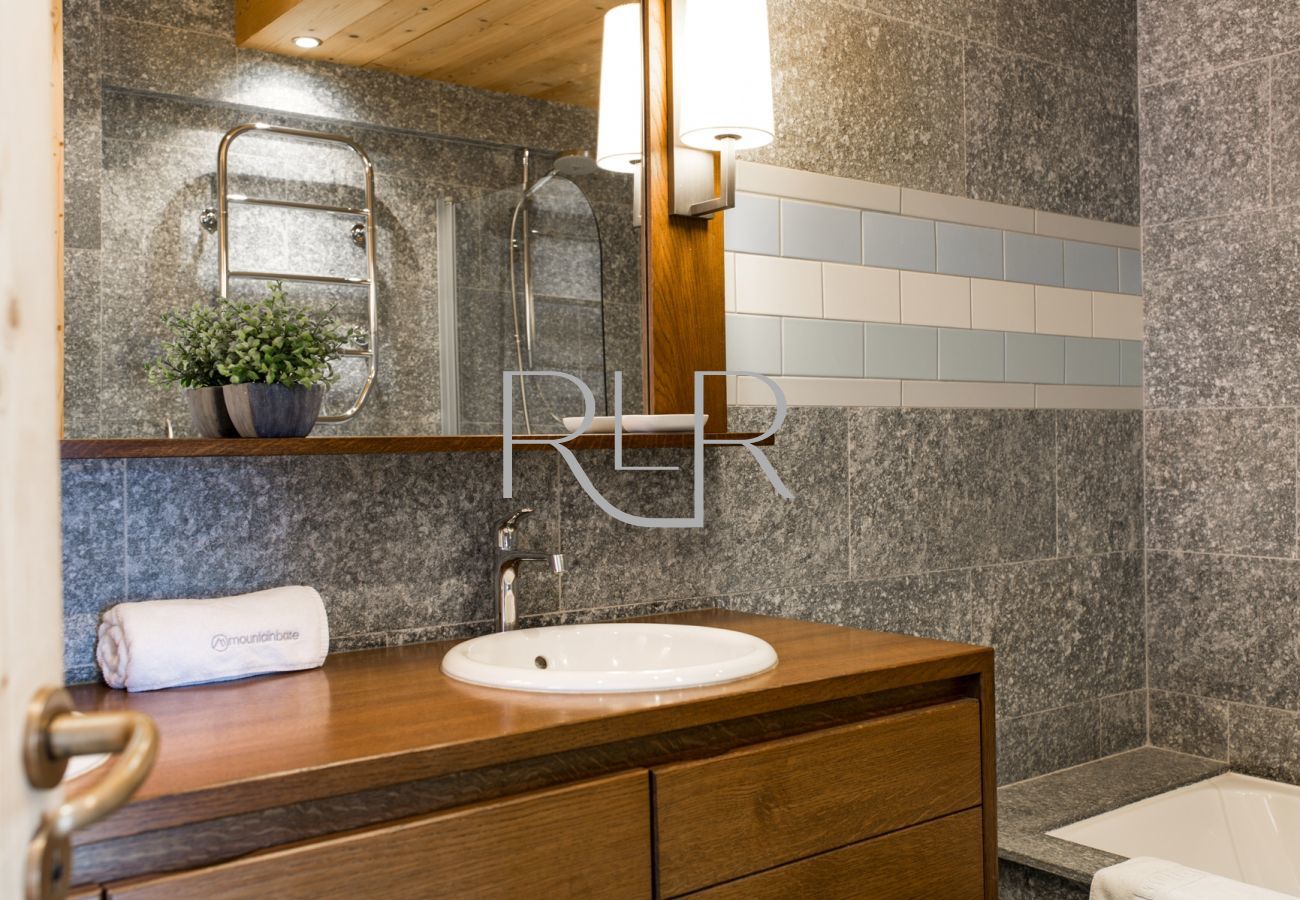 Bedroom 2 of Chalet le Favre has an ensuite bathroom with WC