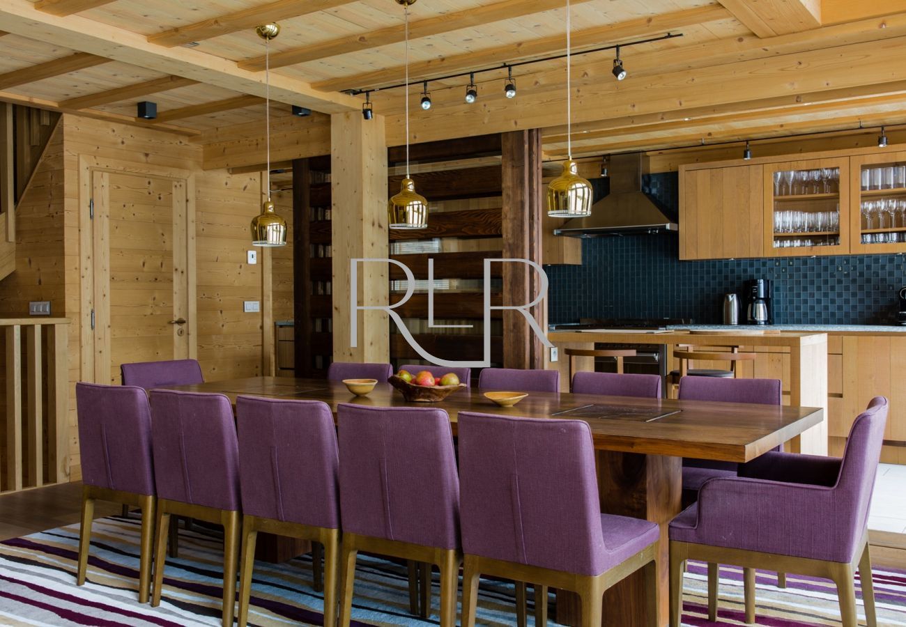 Chalet le Favre has a dining table seating 12 and a sliding divider to the kitchen 
