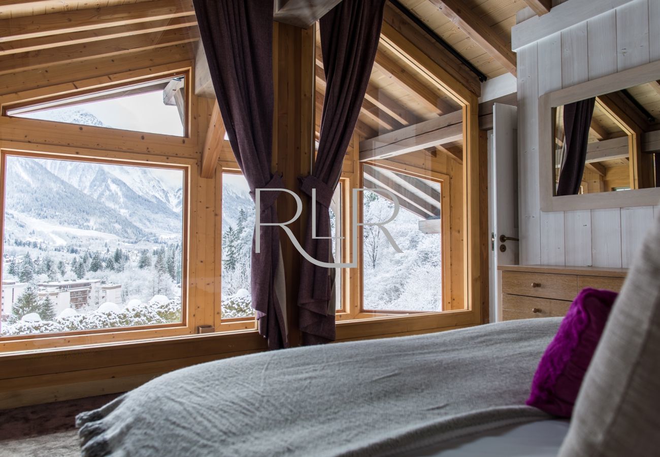 Bedroom 1 of Chalet le Favre has mountain views 
