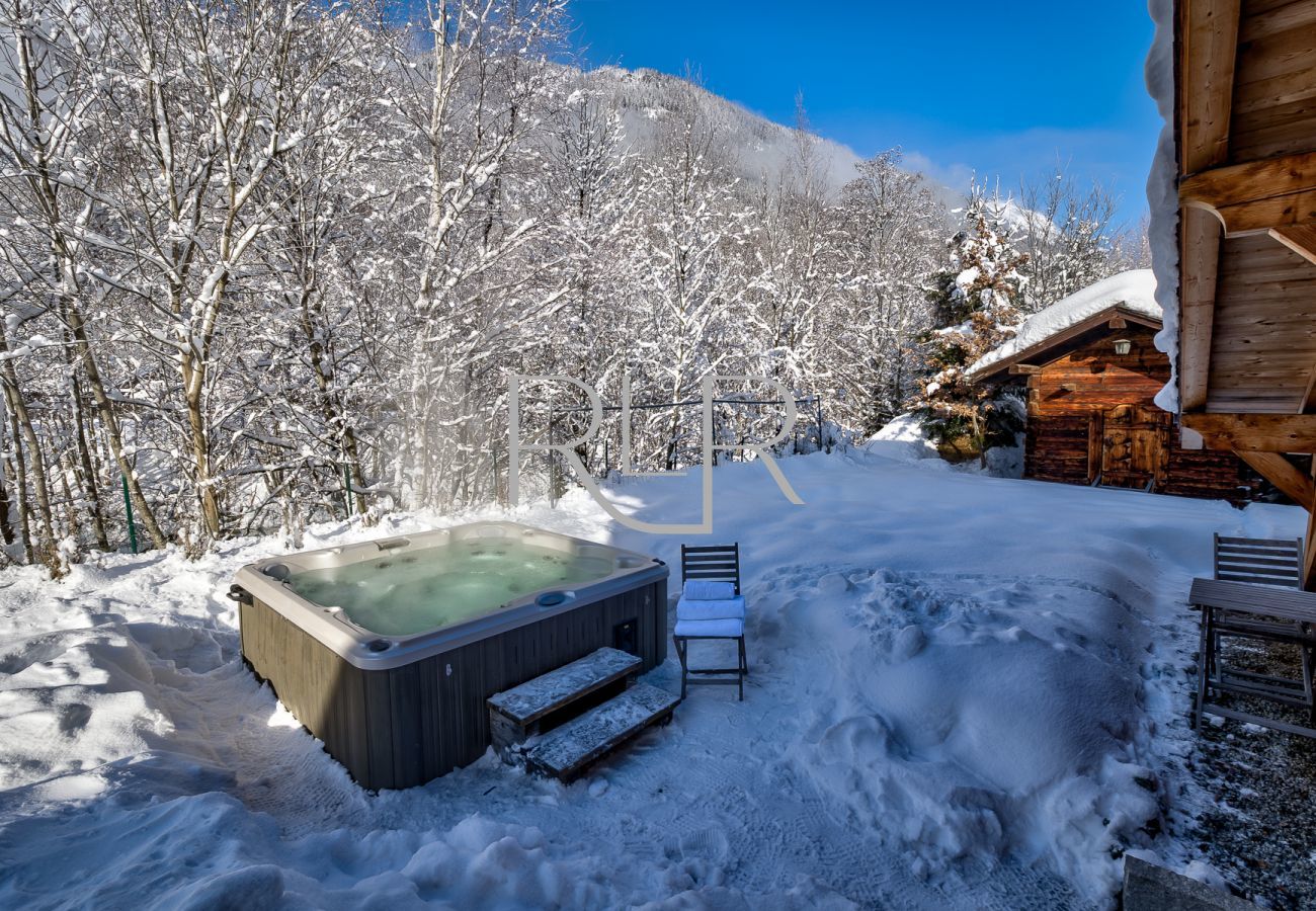 Chalet Amelie has a large hot tub with mountain views
