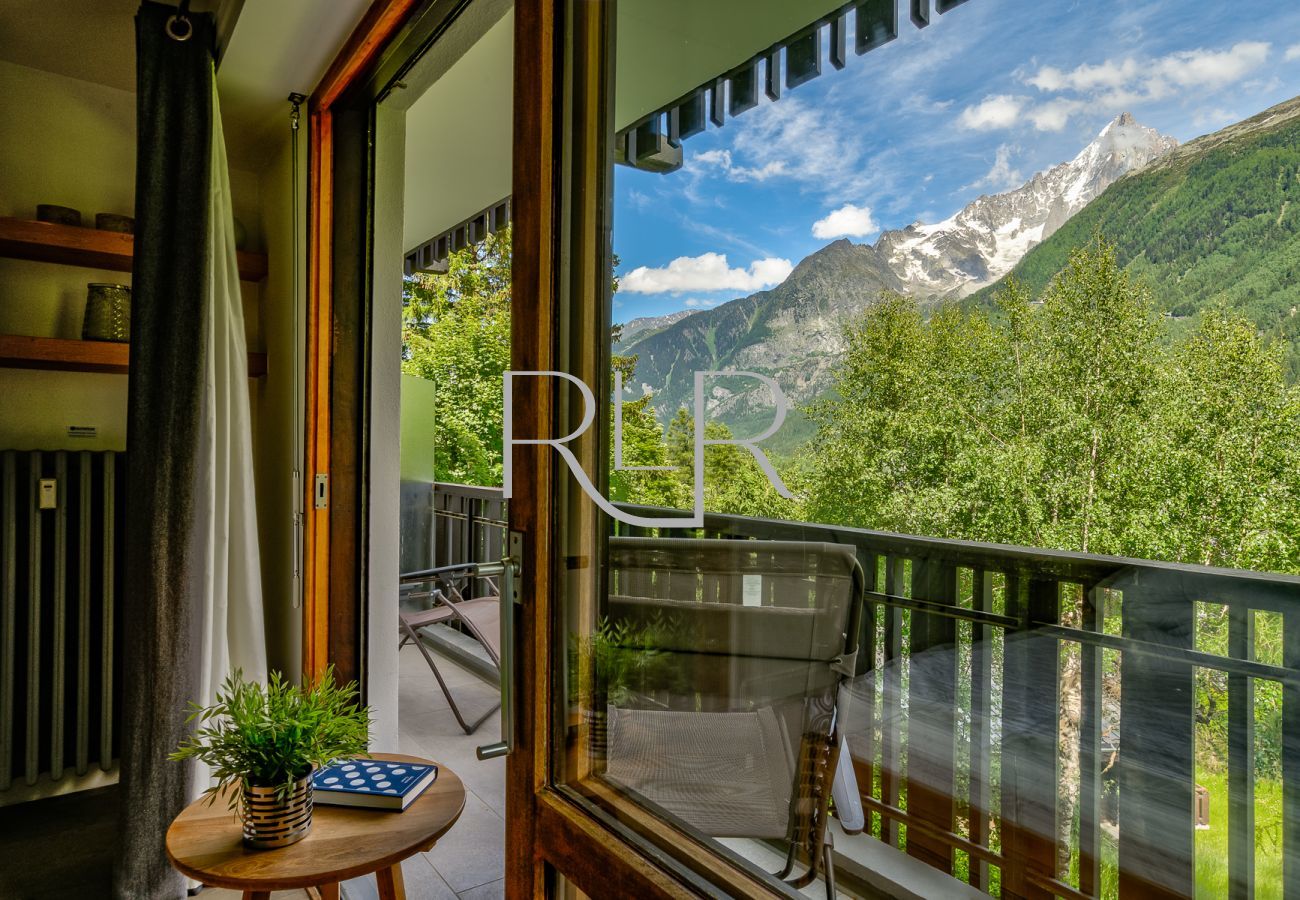 There are loungers on the balcony of Bedroom 1 of Brevent 3