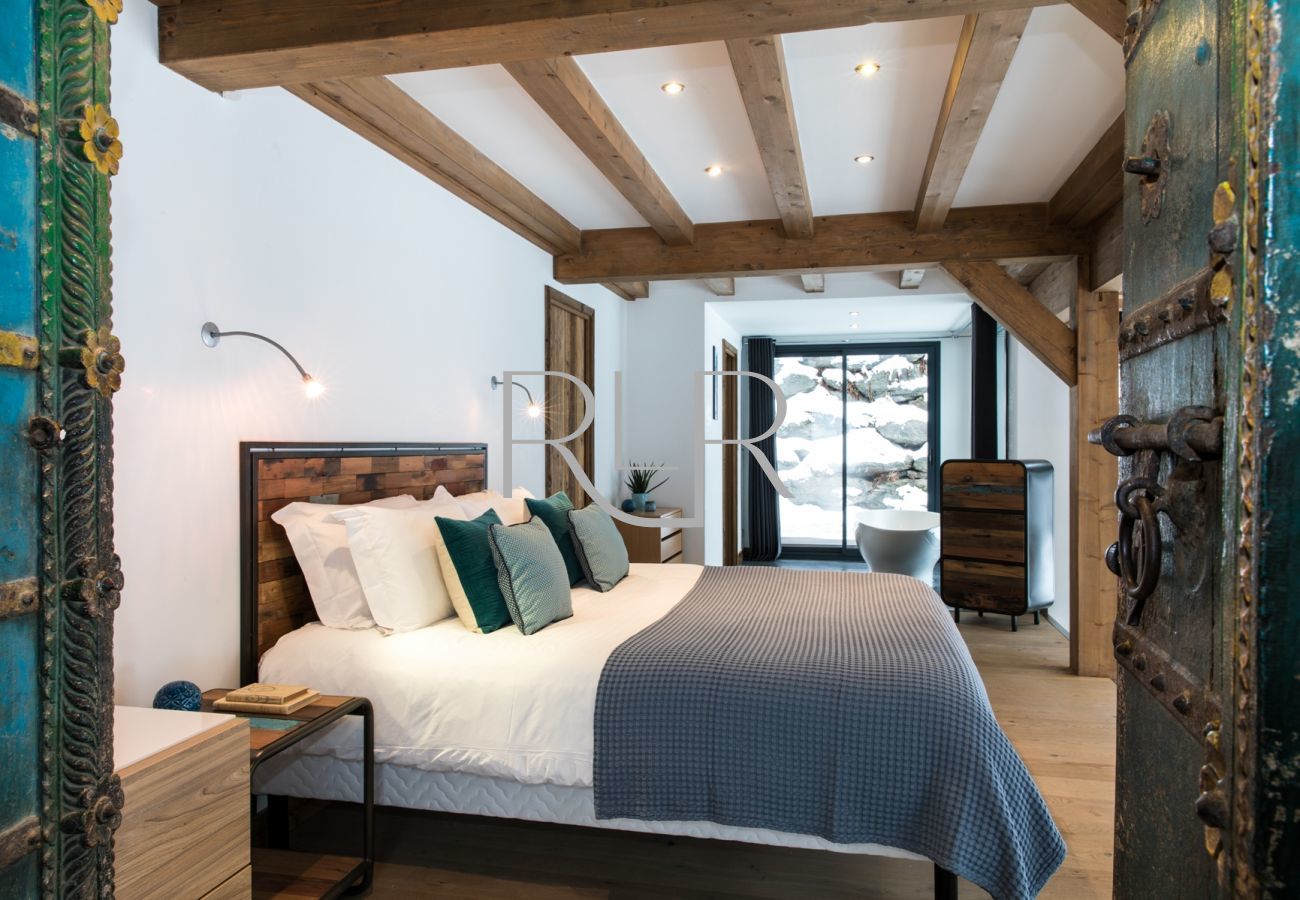 Chalet Belachat has a  beautiful master suite with seating area and access to hot tub deck   