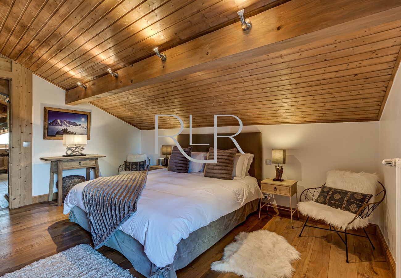 Bedroom 1 of Chalet Sanaz is a double room with an ensuite and shared balcony