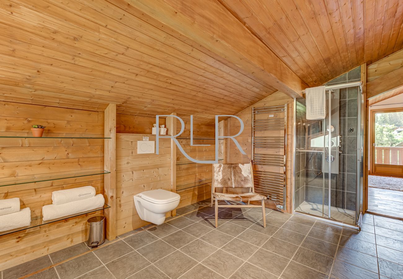 There is a separate shower in the Bedroom 1 ensuite of Chalet Sanaz
