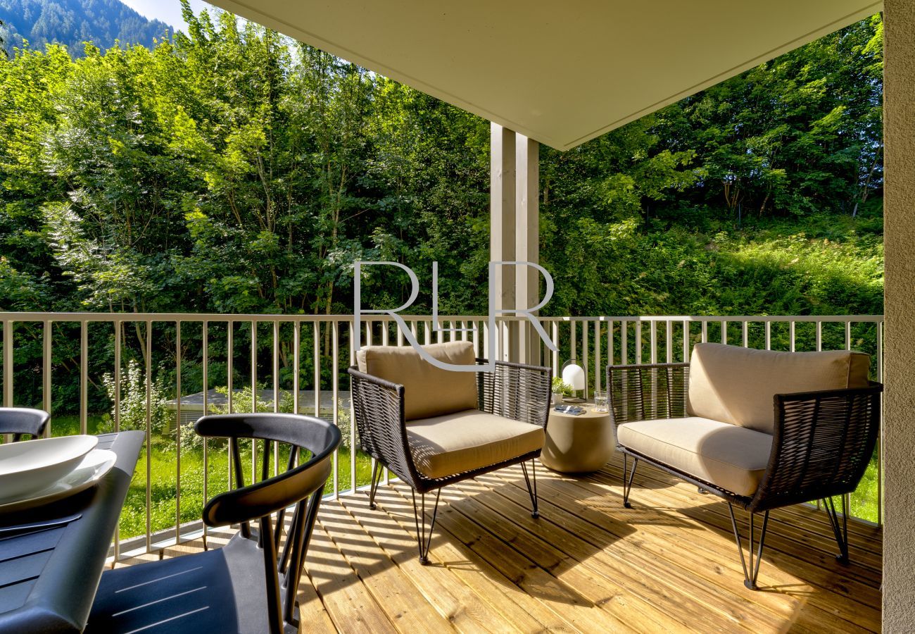 The comfy chairs in White Pearl A11 are the perfect place to relax outside