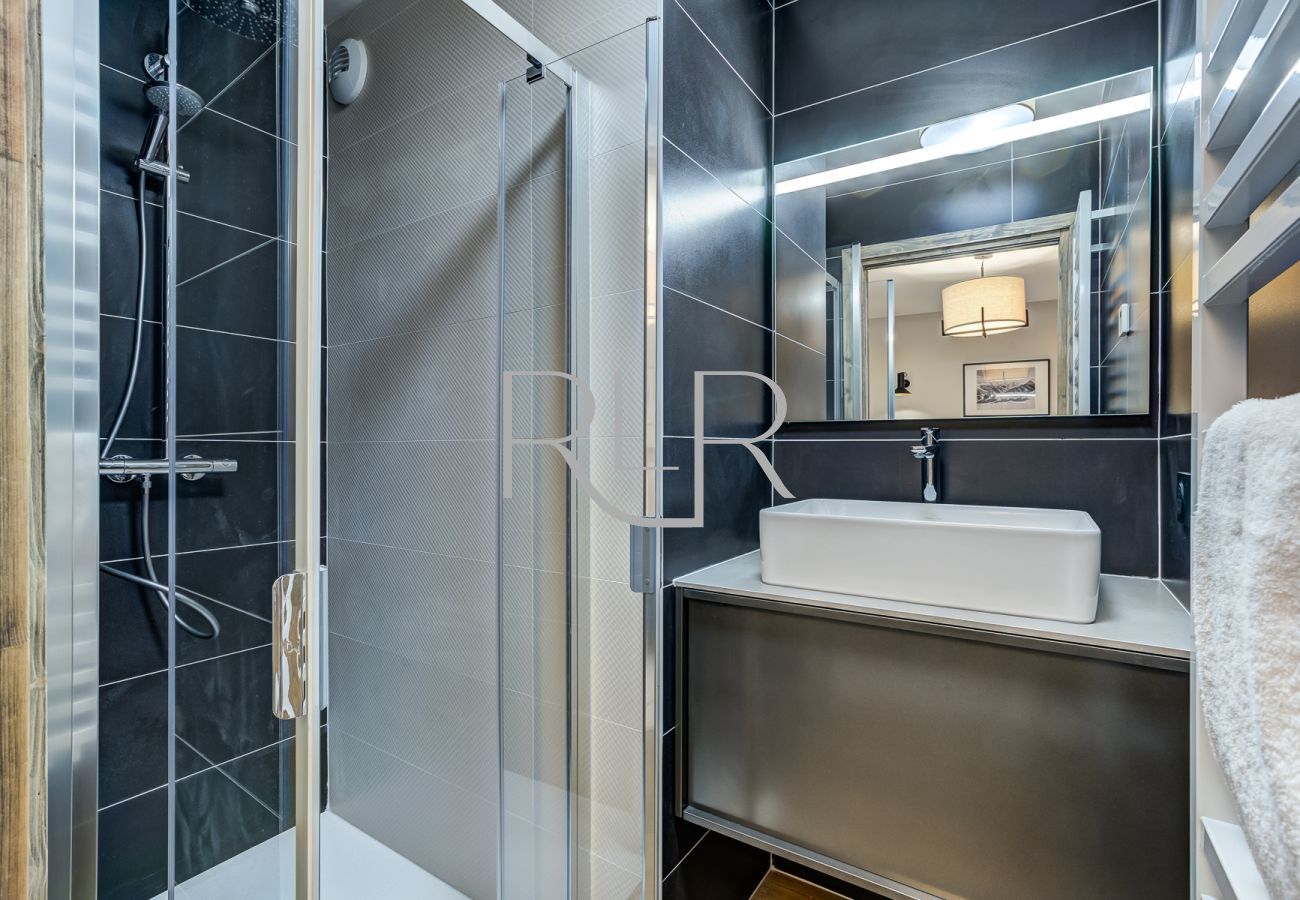 The ensuite to Bedroom 1 of White Pearl A31 has a shower and basin