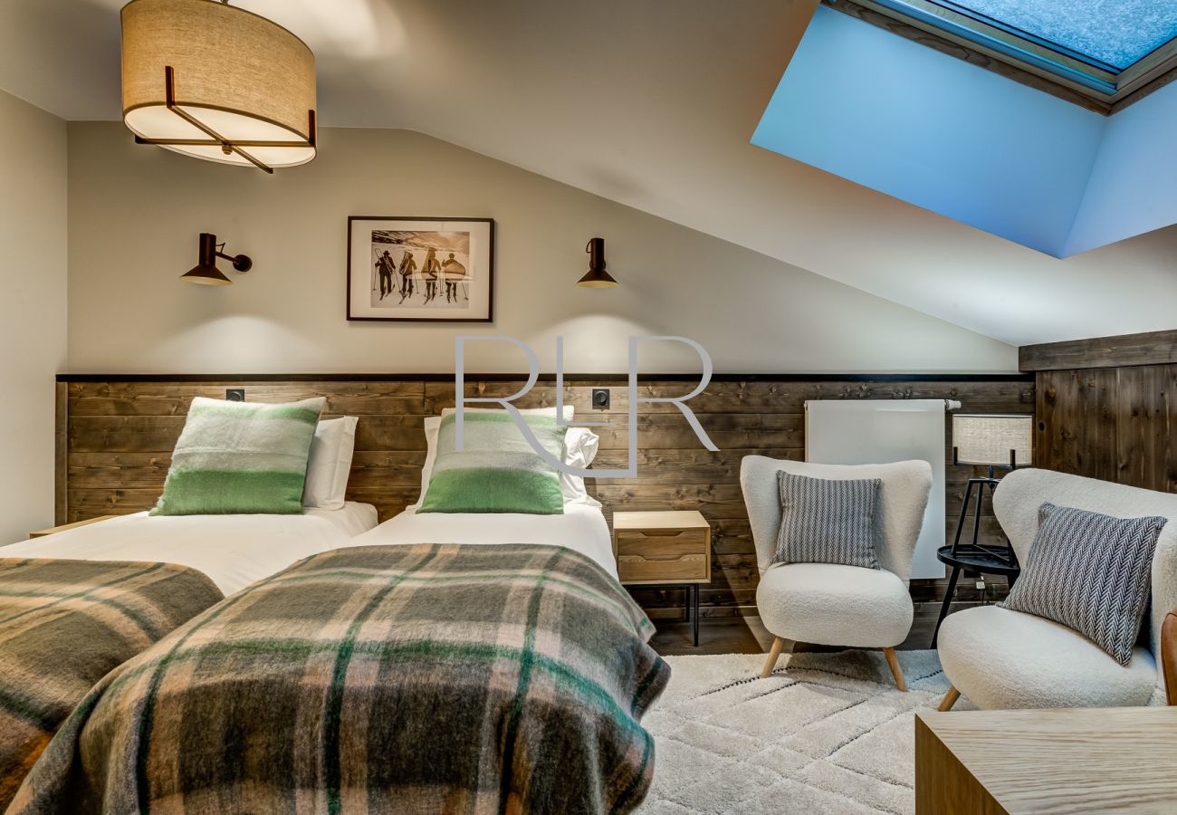 Bedroom 4 of White Pearl A31 is spacious with a desk and a cosy seating area