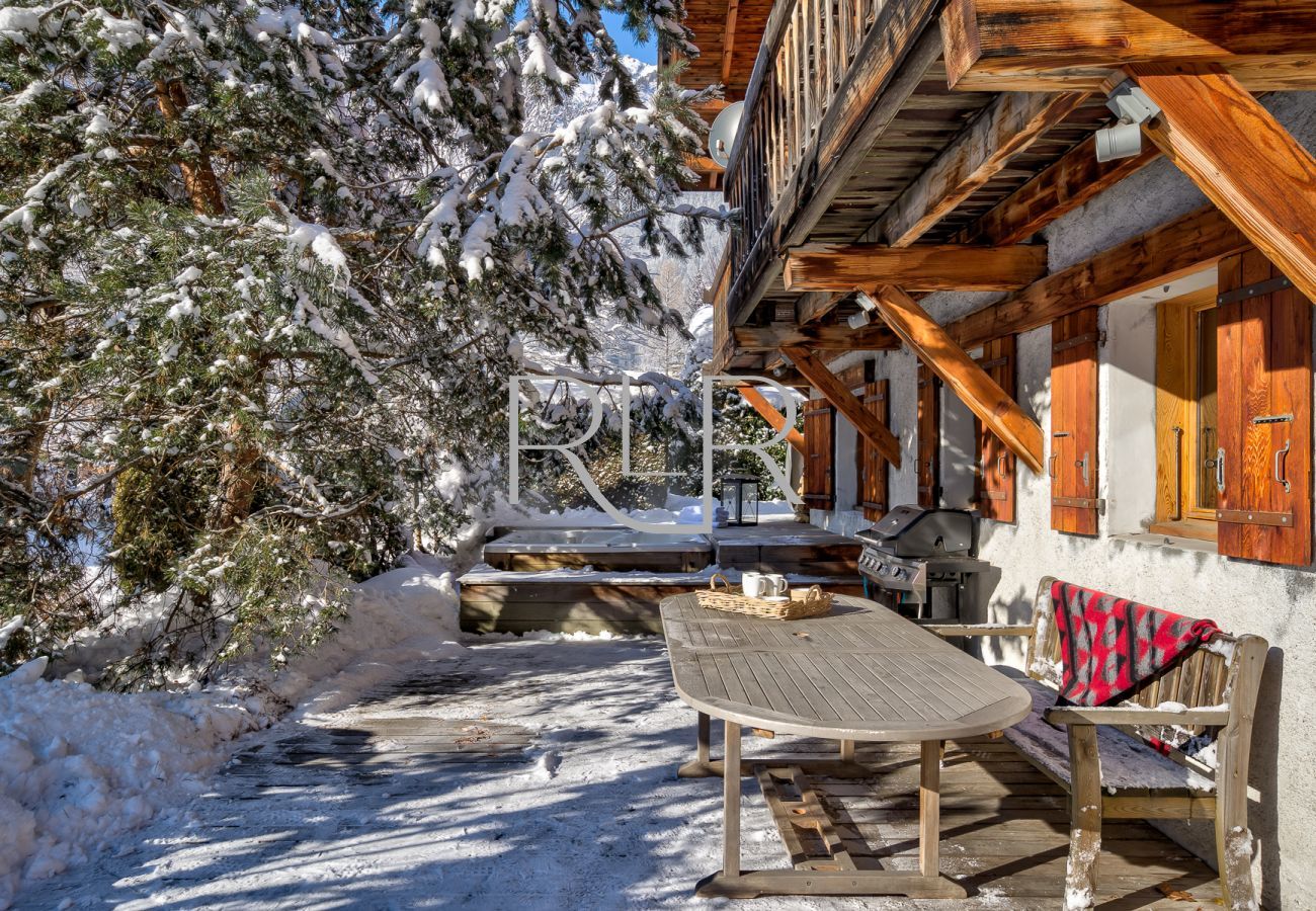 At Chalet les Sauberands, stairs lead from the balcony to the terrace and garden