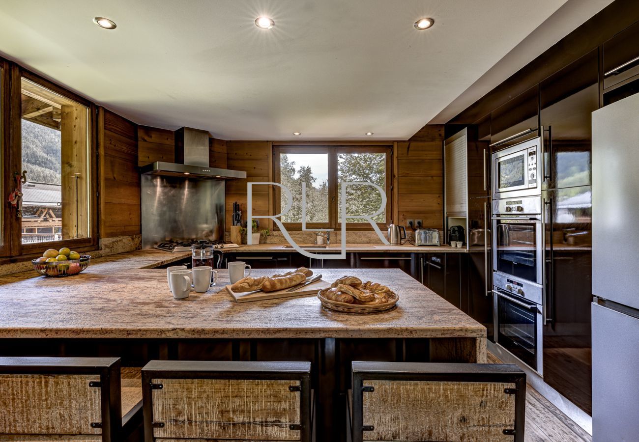 Mountain views brighten up breakfast time around the granite kitchen tops at Chalet les Sauberands