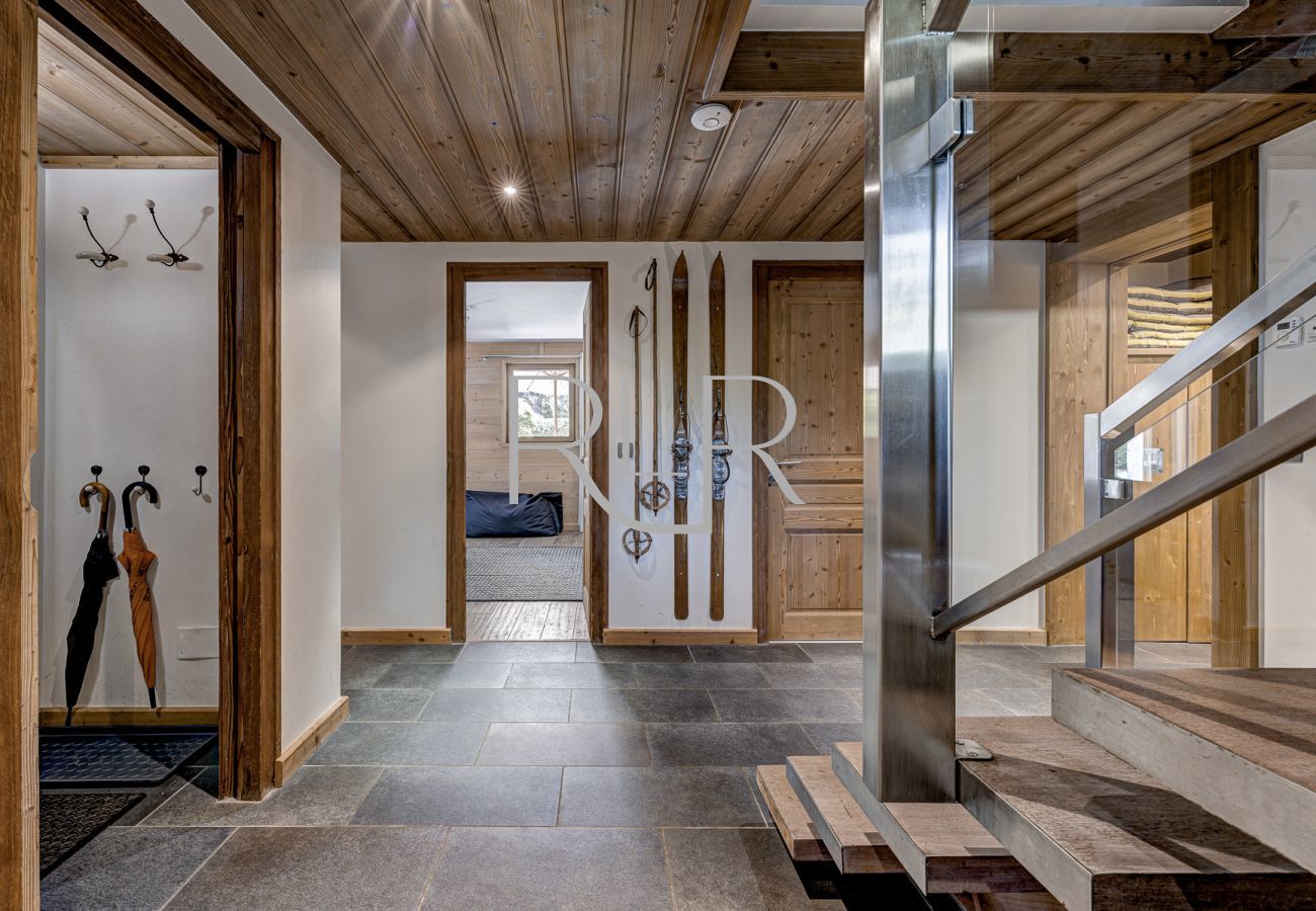 The entrance hall of Chalet les Sauberands leads to 2 bedrooms & a TV room