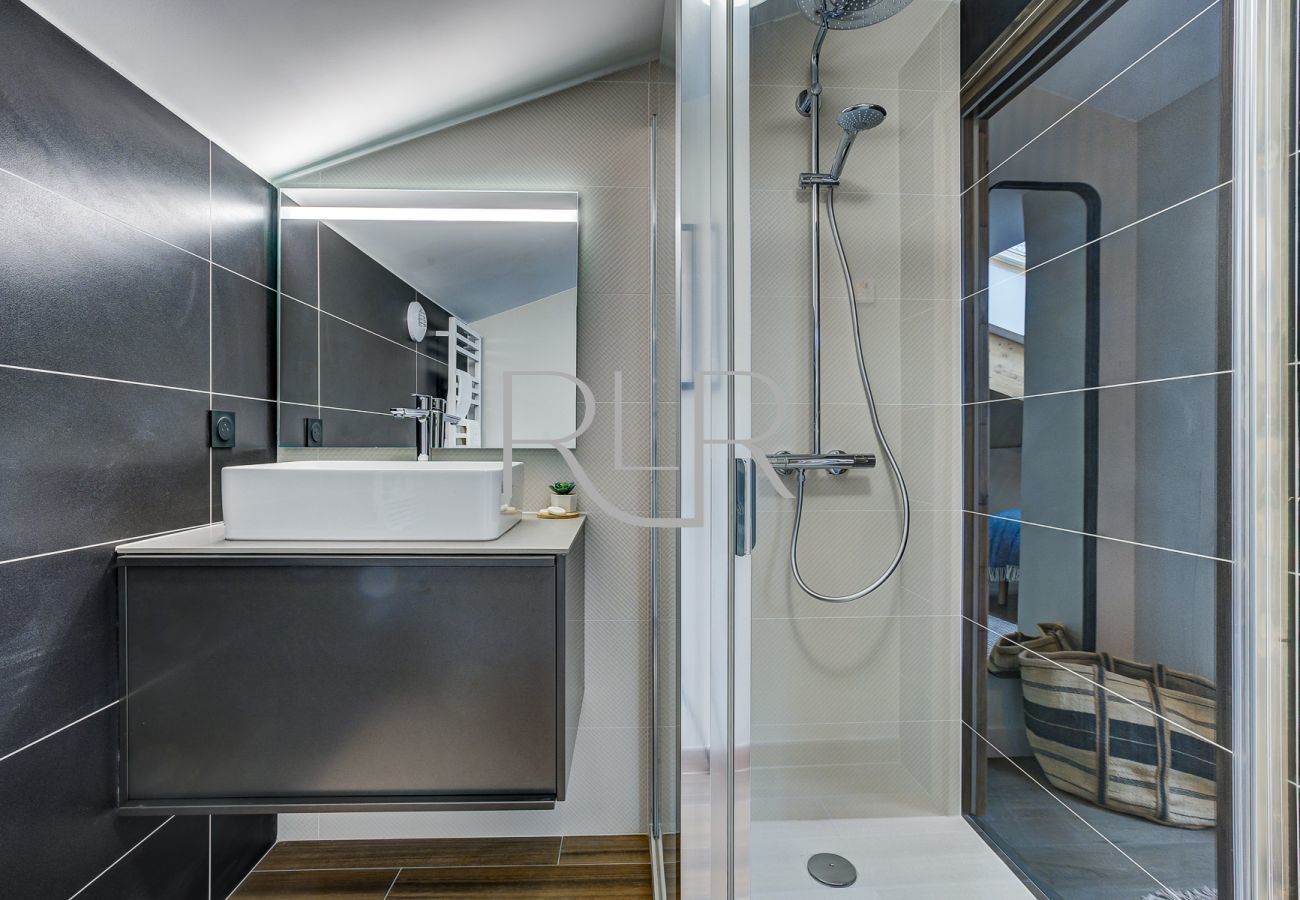 The ensuite to Bedroom 2 of White Pearl A36 has a shower and basin