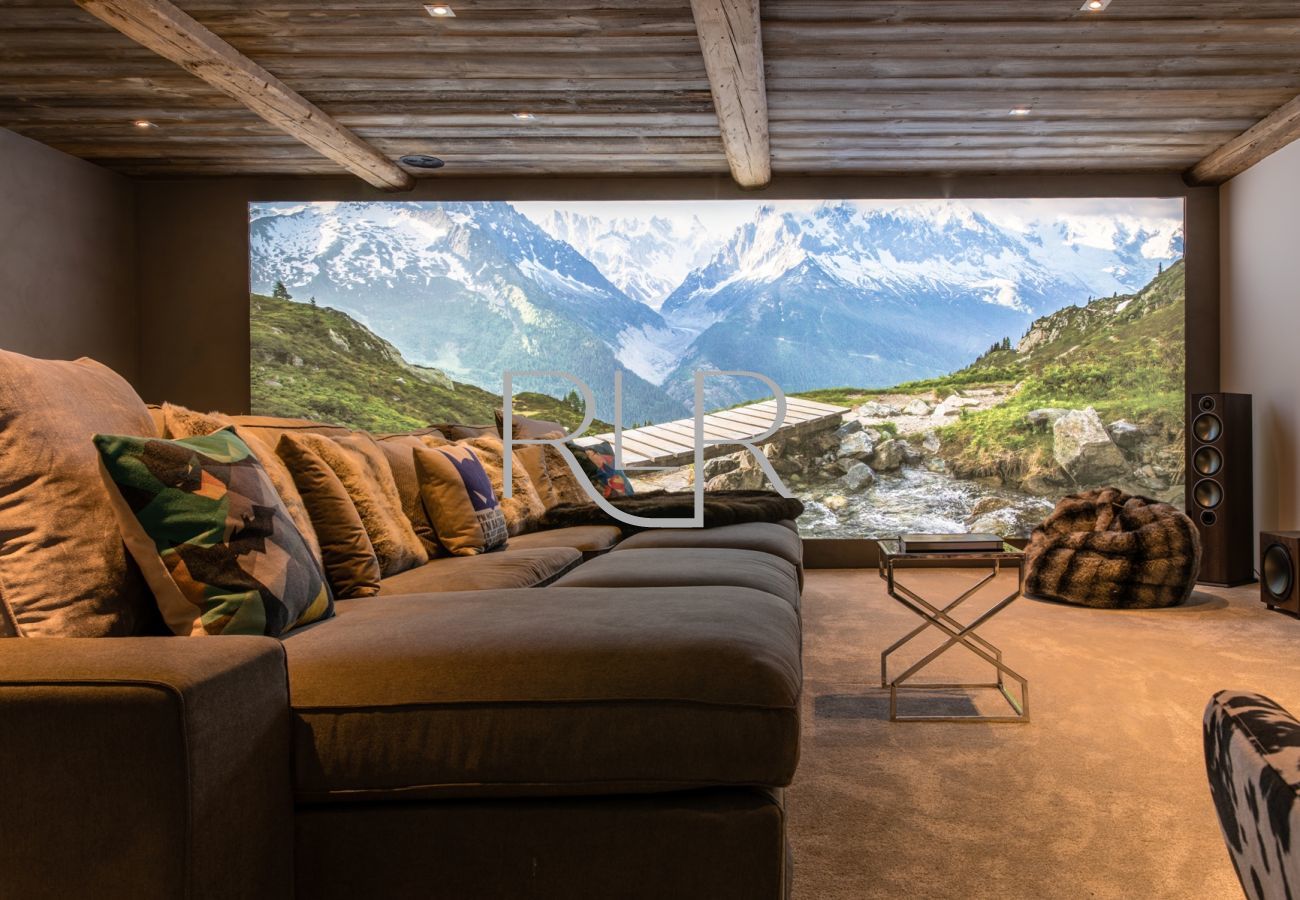 Chalet Seren has a mountain scene lightbox in the cinema room