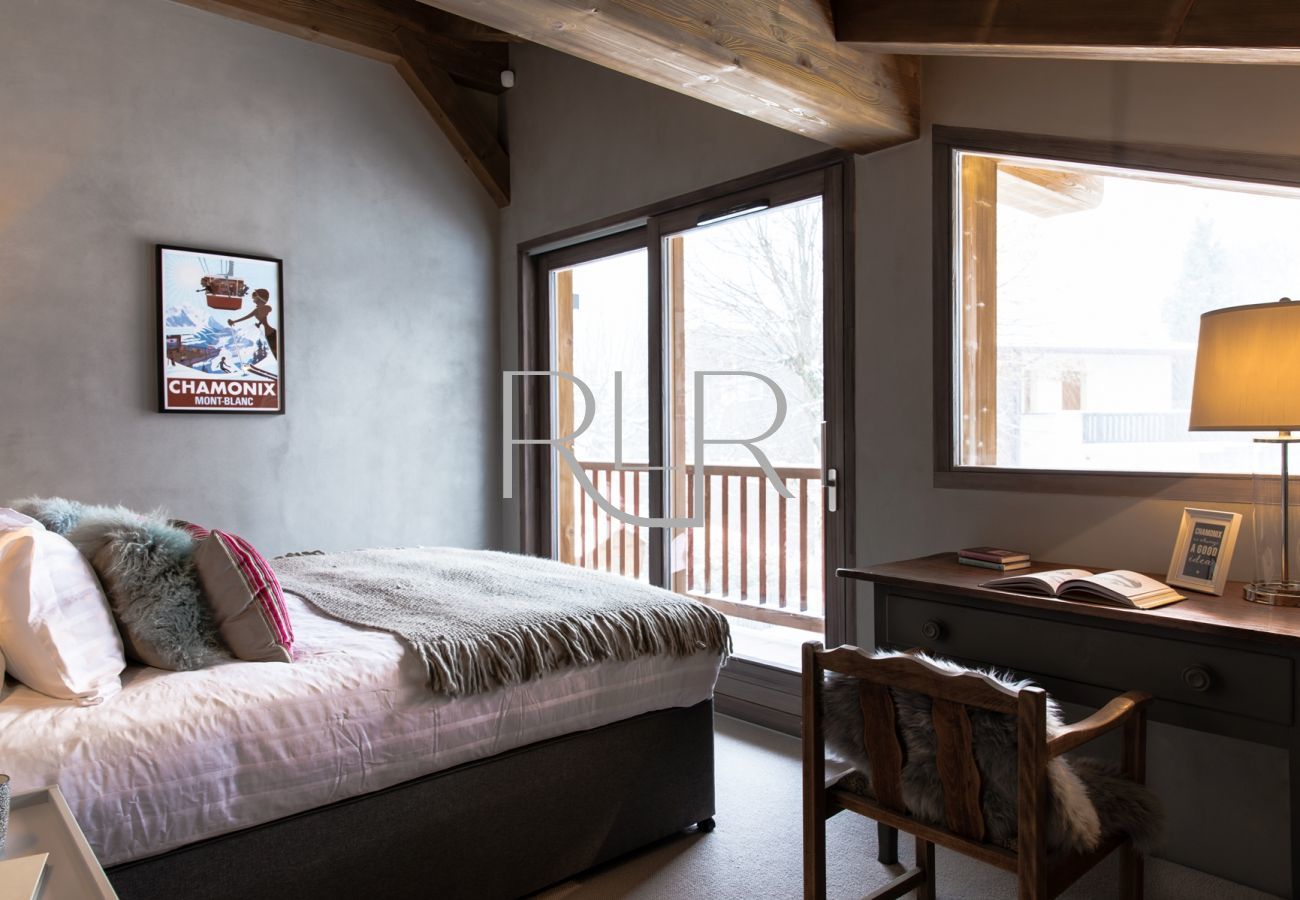 Bedroom 2 of Chalet Seren is a double room with an ensuite and a balcony  