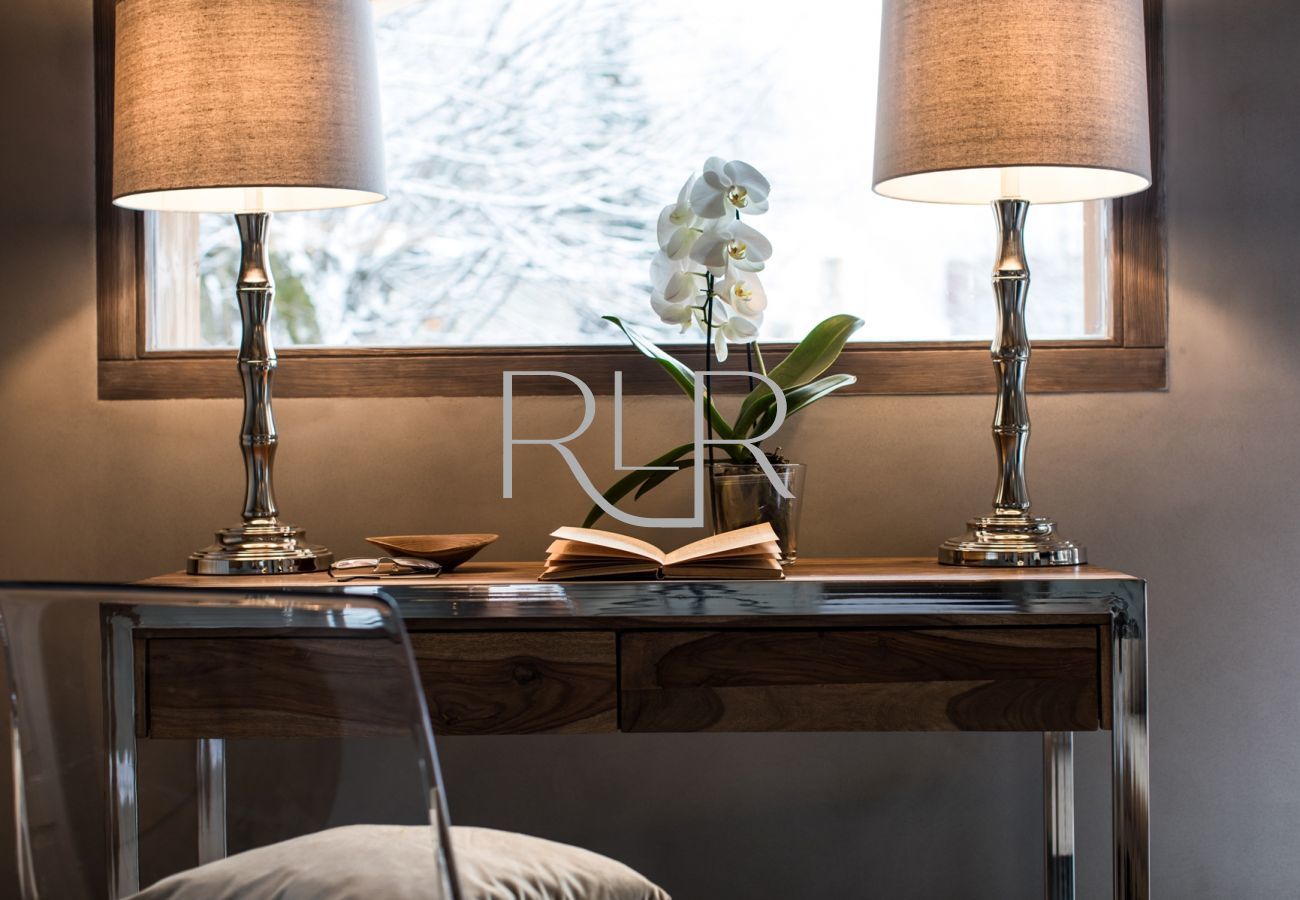 Bedroom 1 of Chalet Seren is spacious with a desk with a view