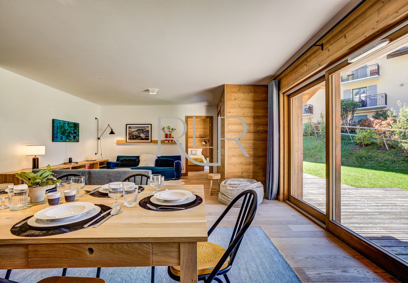 The apartment has large glass doors in the living room leading onto terrace.