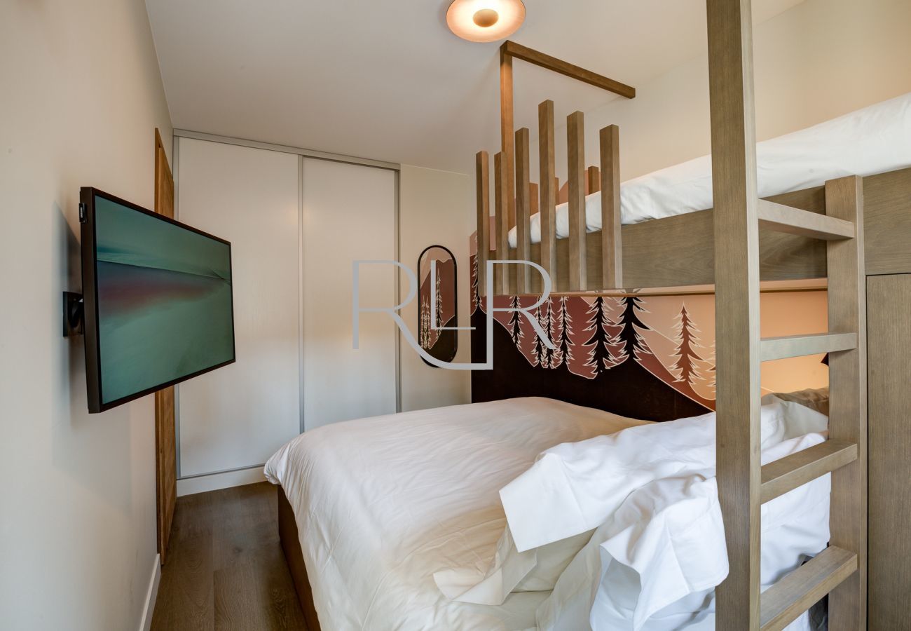 Bedroom 3 of White Pearl A12 has a smart TV and built-in storage