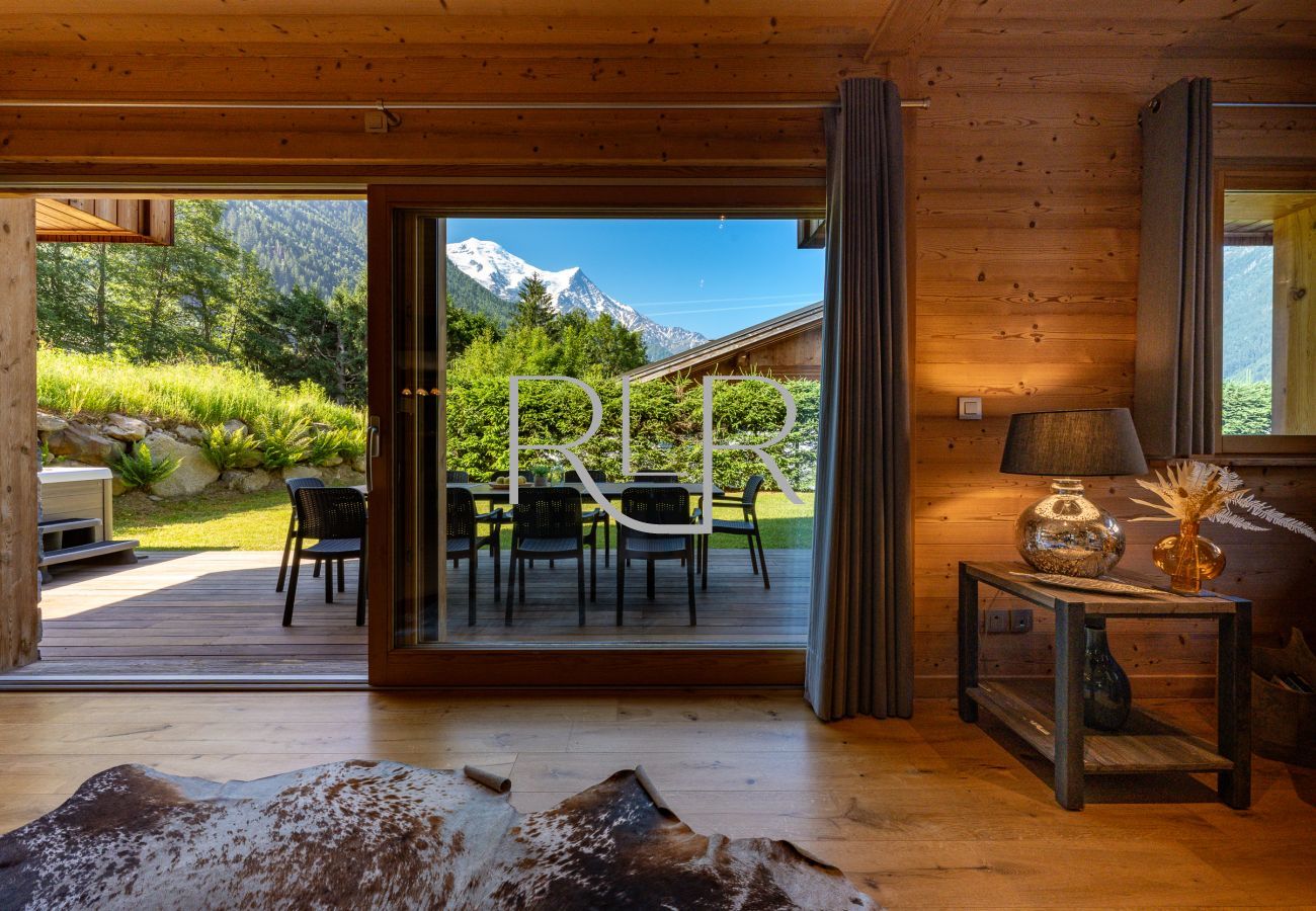 Chalet Planards 2 has large glass doors opening onto the terrace and garden