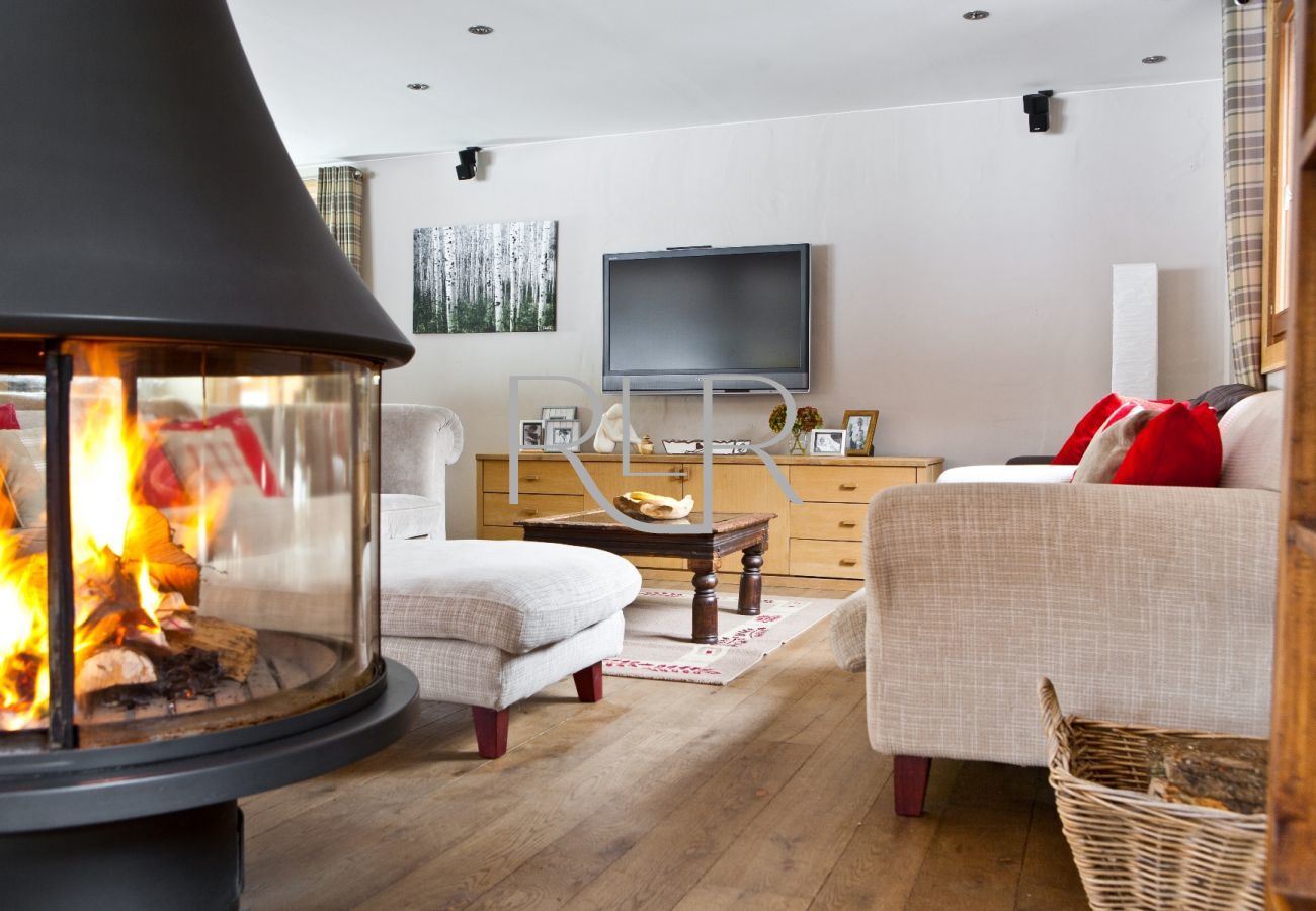 Chalet les Favrands has a circular feature log burner in winter only