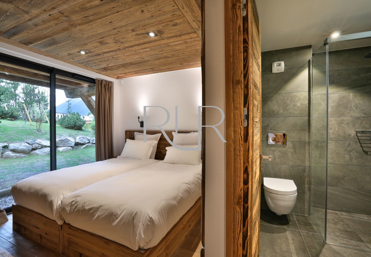 Bedroom 2 of Chalet Black Stone is a double or twin room with an ensuite shower room 