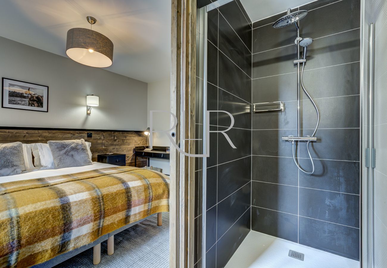The ensuite to Bedroom 1 of White Pearl A34 has a shower and basin