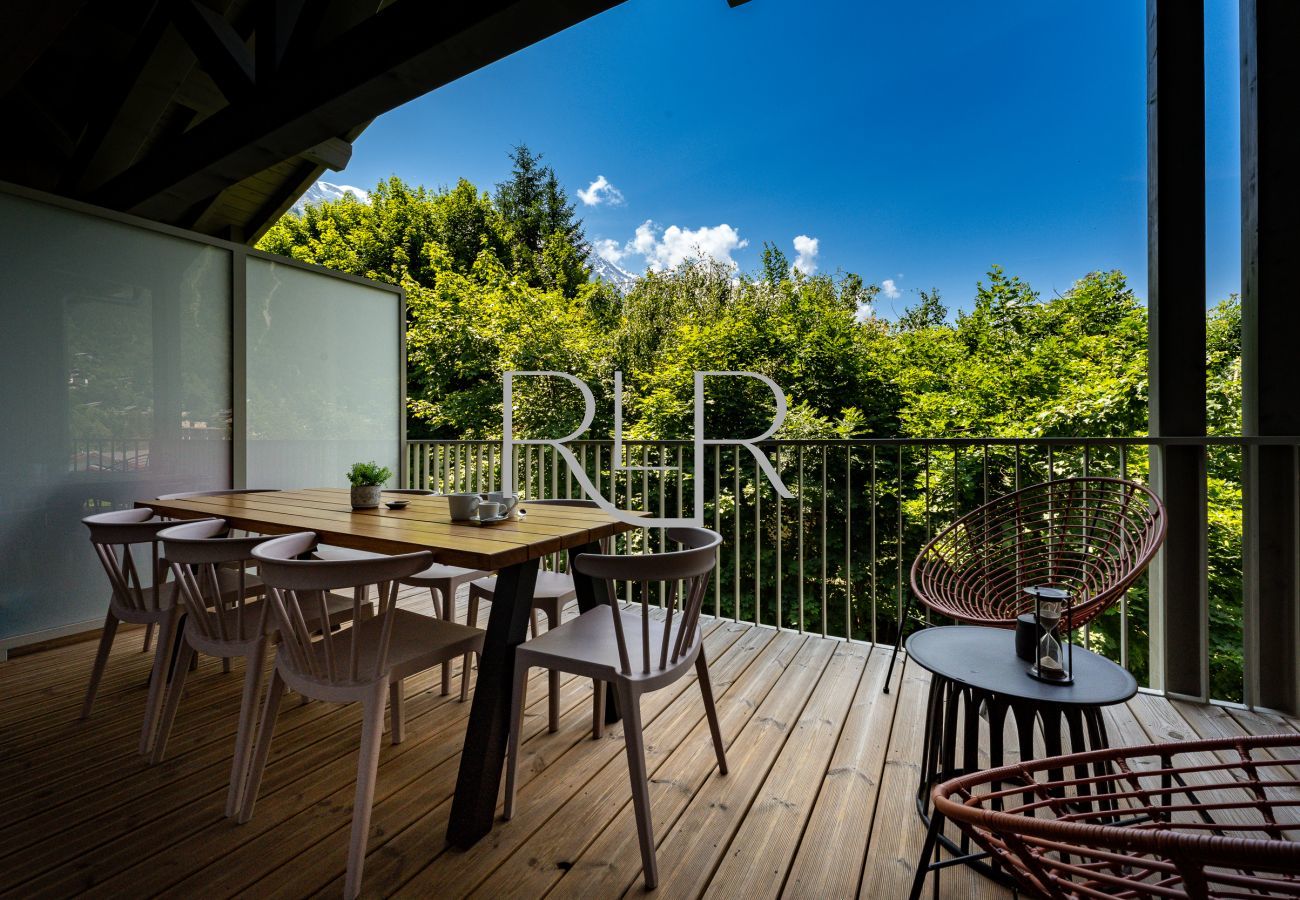 This apartment has outdoor furniture for dining and relaxing