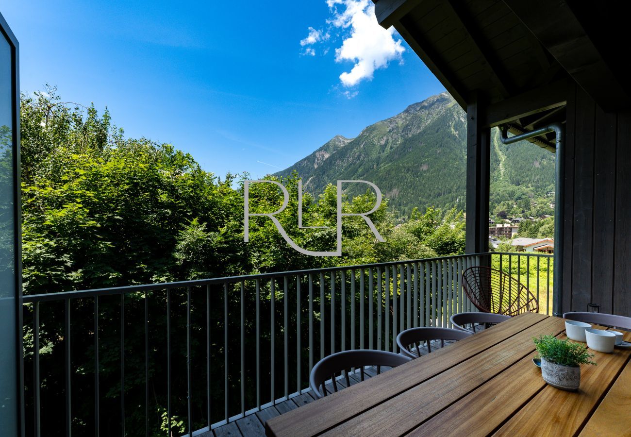 The apartment has a view of the mountains from the balcony.