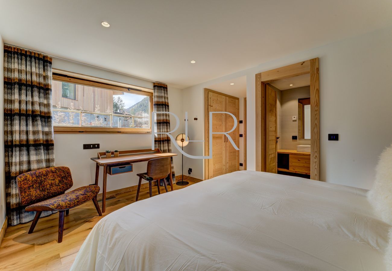 Bedroom 2 of Chalet les Trois Soeurs is spacious with room to work