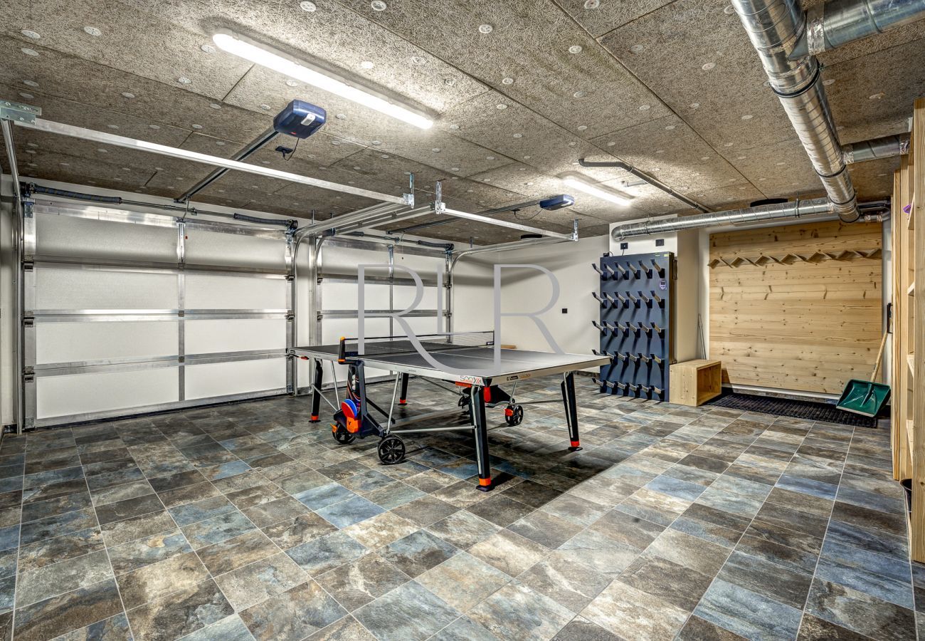 Chalet les Trois Soeurs has a double garage with electric car charger, heated boot dryers and ski storage