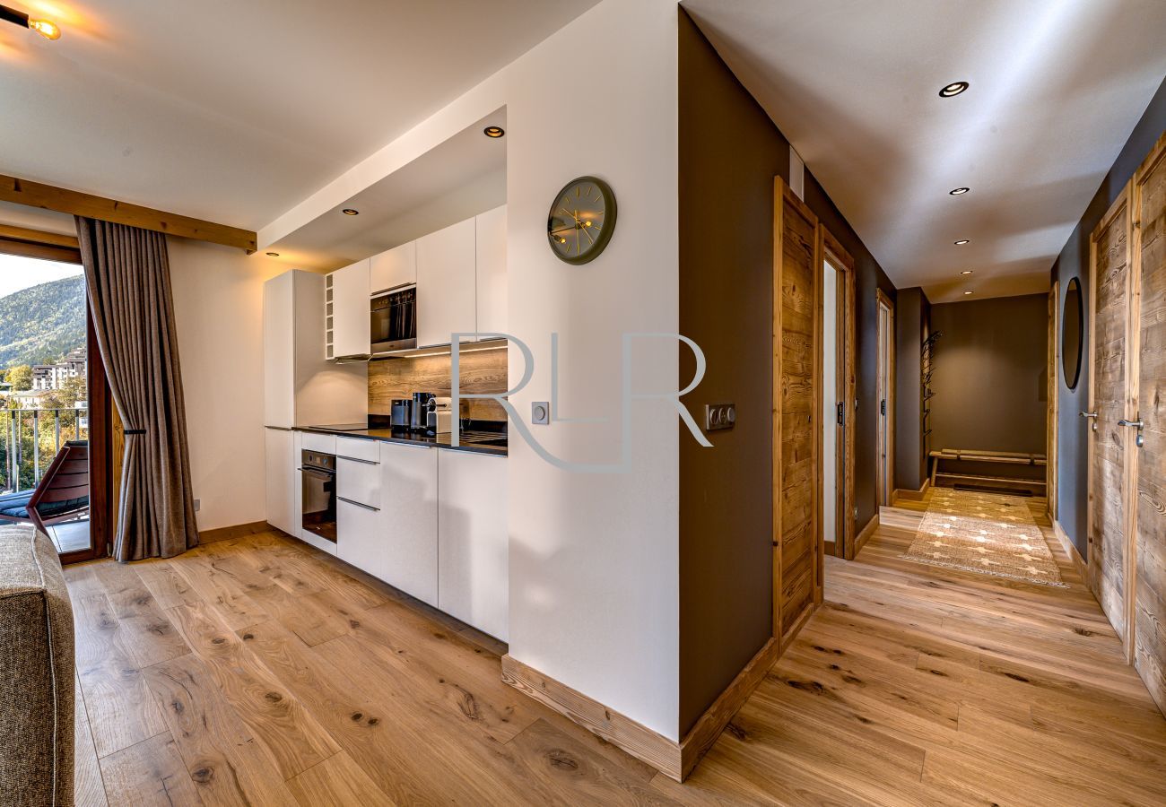 The hallway of Blanc Mont Blanc 303 opens into a bright living area.