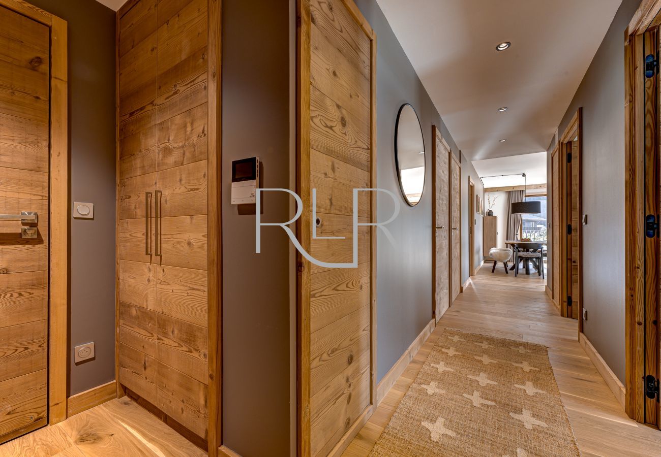 Bedrooms and bathroom are off the hallway in apartment Blanc Mont Blanc 303.
